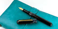 ye yu fountain pen_on_turquoise_notebook